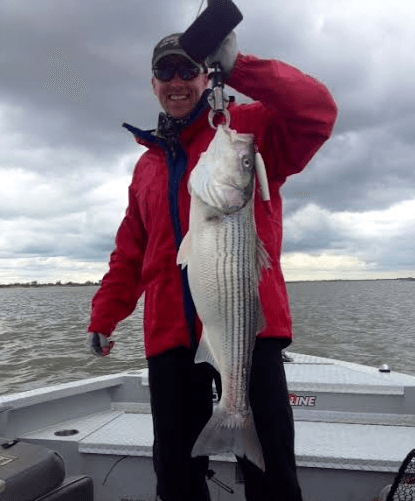 Tory with a nice striper caught with JD on Tues. It was one of many that slashed on topwater